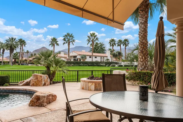 a view of a patio with couches table and chairs