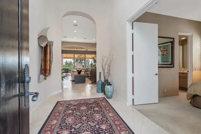 a living room with furniture and a rug