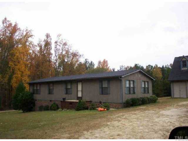2147 Bailey Road Coats, NC 27521 - Photo 1 of 1 a front view of a house with a garden