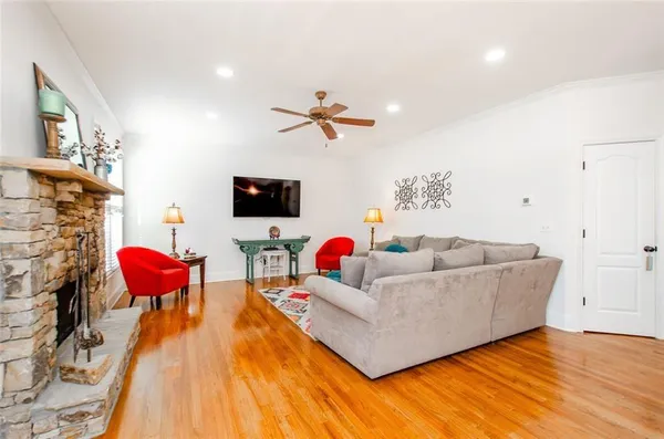 a living room with furniture fireplace and window