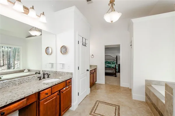 a view of walk in closet with clothes