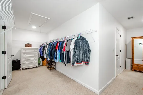 a bathroom with a sink vanity tub and shower