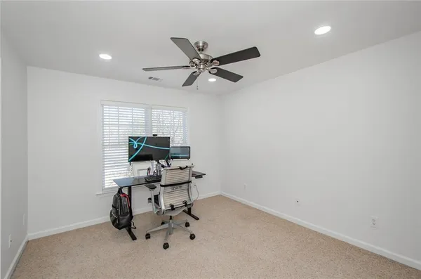 a view of a livingroom with a workspace