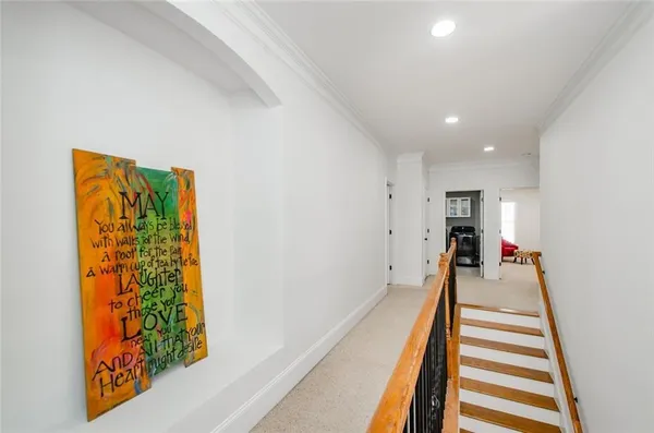 a view of swimming pool with large trees and wooden fence