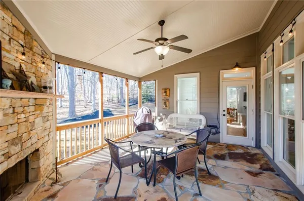 a view of a field with trees in the background