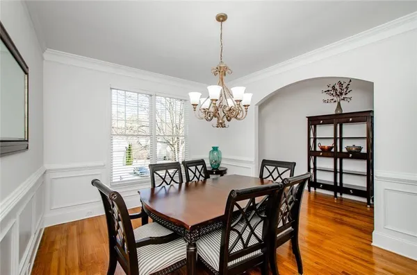 a view of a dining room with furniture and window