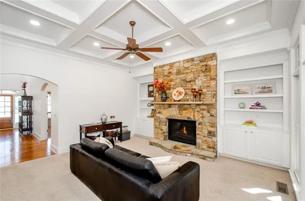 a living room with furniture and a fireplace