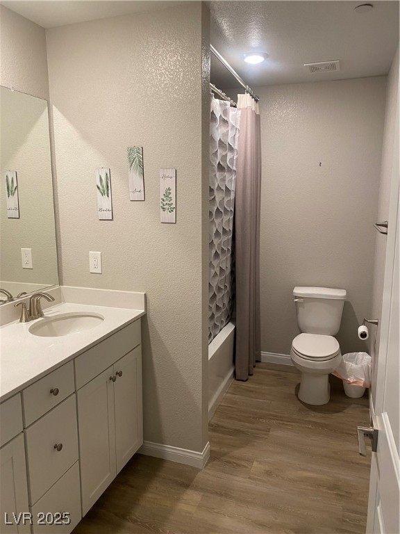 9343 Sully Avenue Las Vegas, NV 89149 - Photo 10 of 27 Full bath with toilet, vanity, wood finished floor