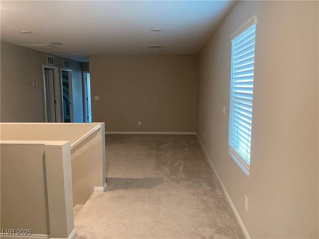 9343 Sully Avenue Las Vegas, NV 89149 - Photo 13 of 27 Hall with baseboards, carpet flooring, and visible