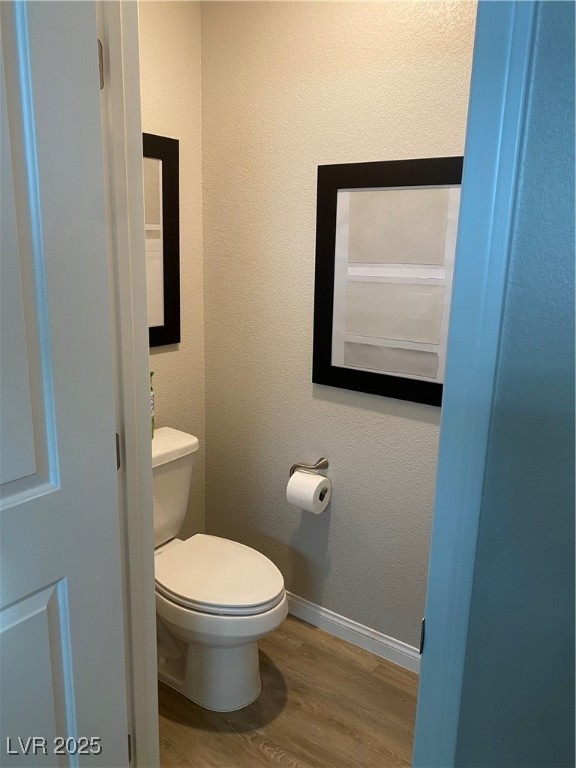 9343 Sully Avenue Las Vegas, NV 89149 - Photo 16 of 27 Bathroom with baseboards, a textured wall, wood fi