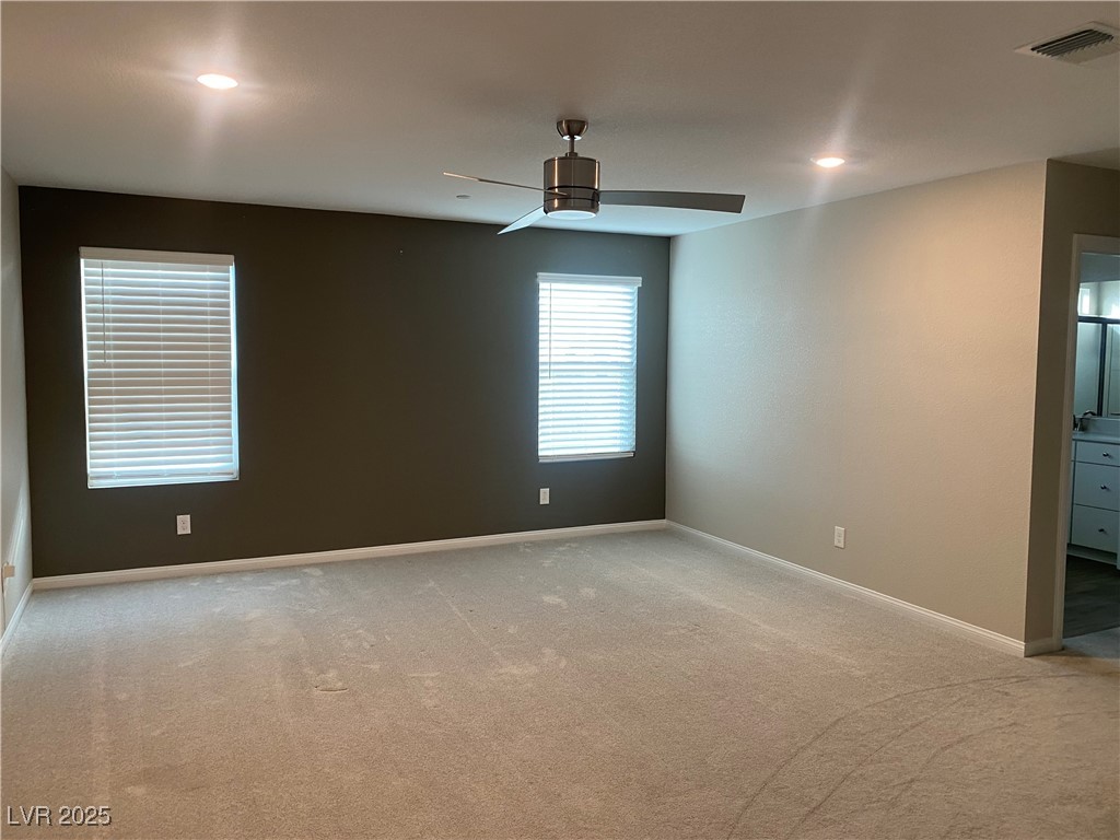 9343 Sully Avenue Las Vegas, NV 89149 - Photo 20 of 27 Empty room featuring baseboards, light colored car