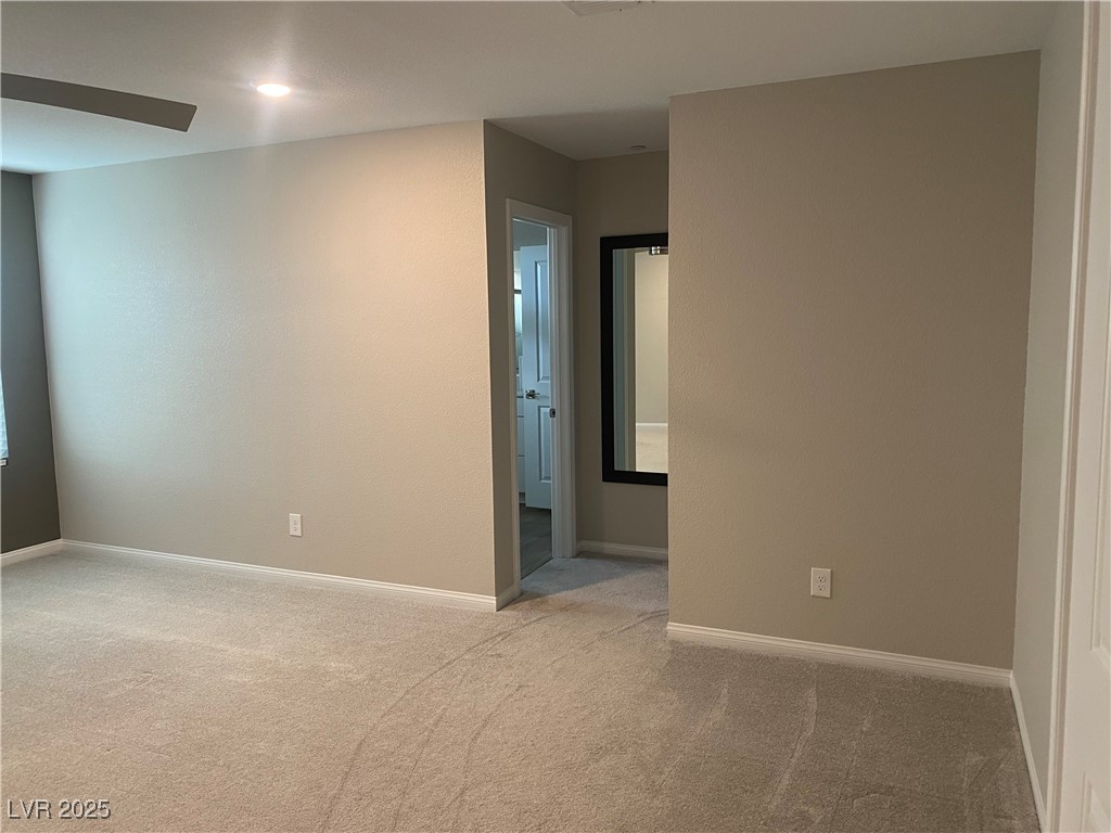 9343 Sully Avenue Las Vegas, NV 89149 - Photo 21 of 27 Carpeted empty room featuring baseboards