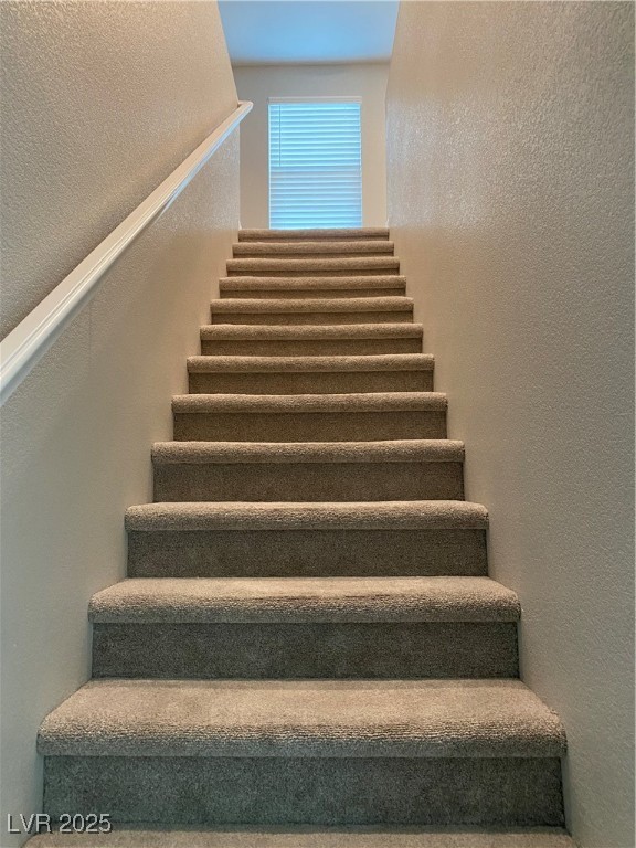 9343 Sully Avenue Las Vegas, NV 89149 - Photo 22 of 27 Stairway featuring a textured wall