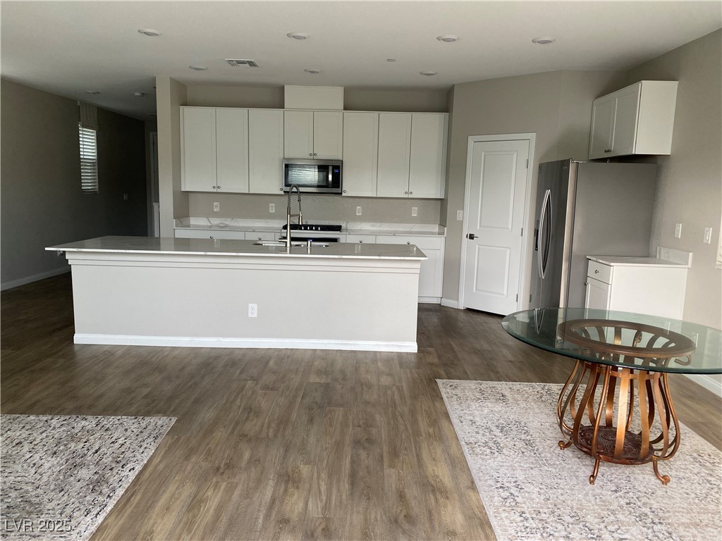 9343 Sully Avenue Las Vegas, NV 89149 - Photo 24 of 27 Kitchen featuring stainless steel appliances, dark