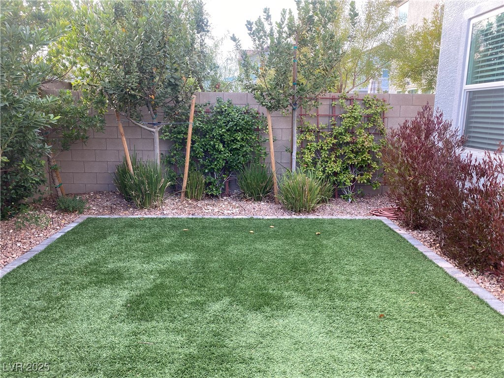 9343 Sully Avenue Las Vegas, NV 89149 - Photo 25 of 27 View of yard featuring a fenced backyard