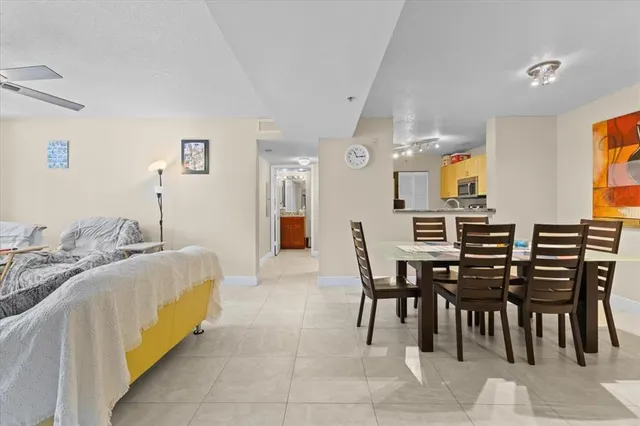 a spacious bedroom with a bed and a table