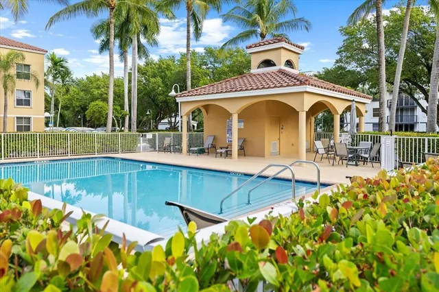 a view of a swimming pool with a patio