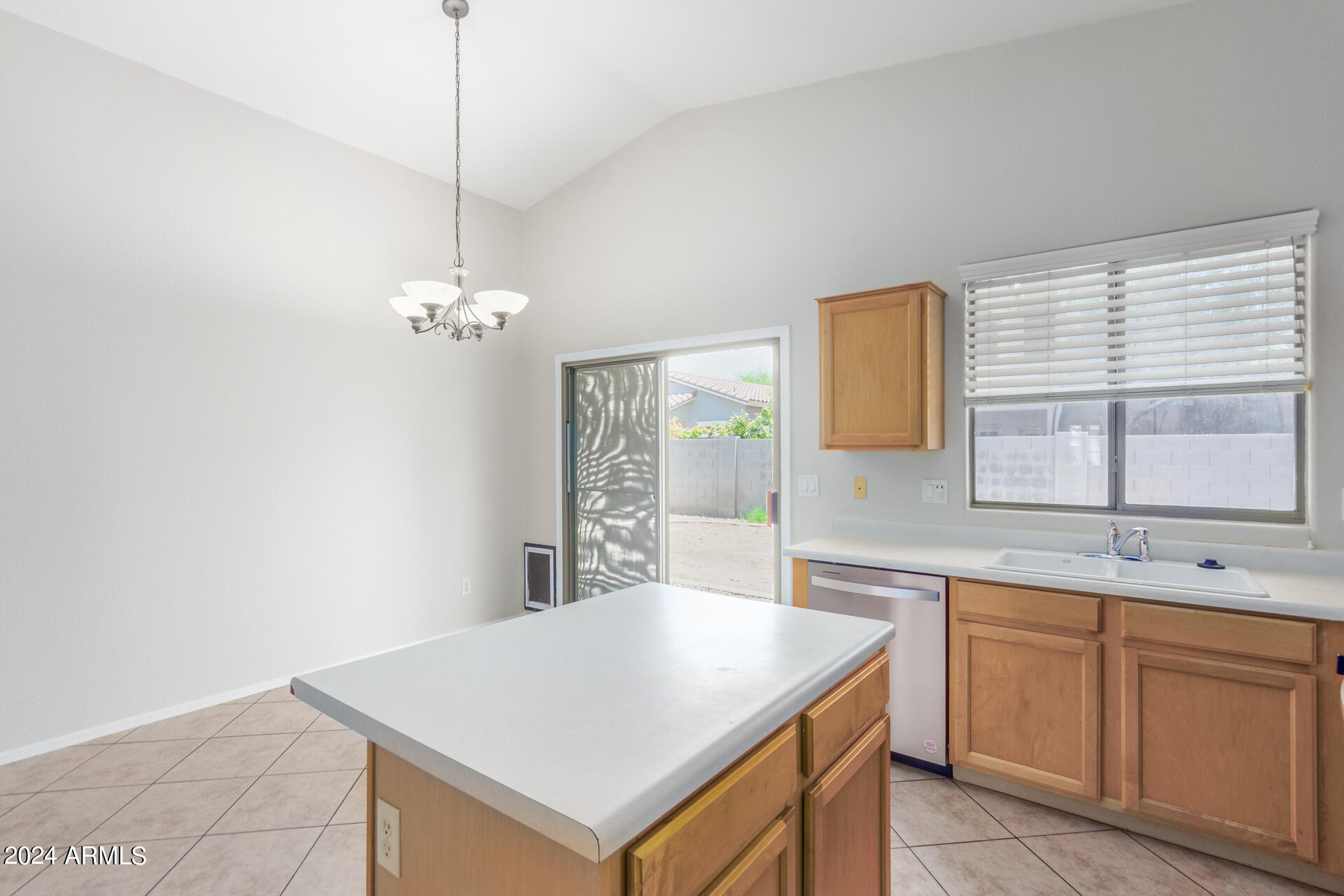4007 East Ironhorse Road Gilbert, AZ 85297 - Photo 17 of 33 a kitchen with a sink a counter space cabinets and appliances