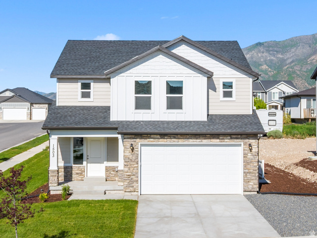 1503 South Deerbrook Road, Unit SR 255 Santaquin, UT 84655 - Photo 1 of 13 Contemporary exterior with stone accents, a covered front porch, and a two-car garage