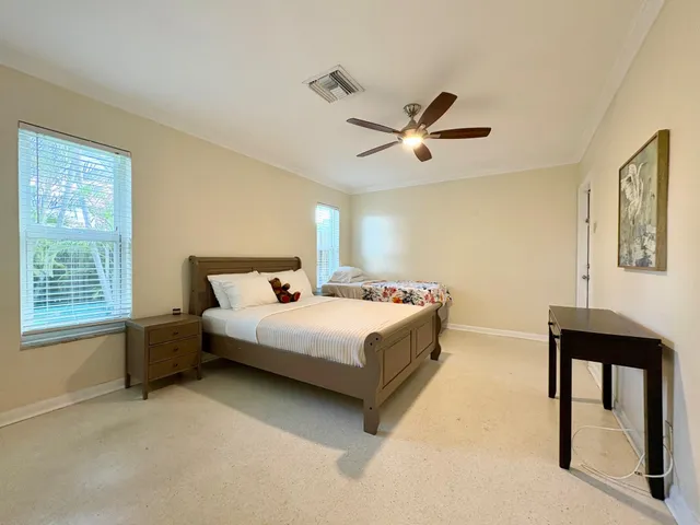 a bedroom with a bed and a table in it