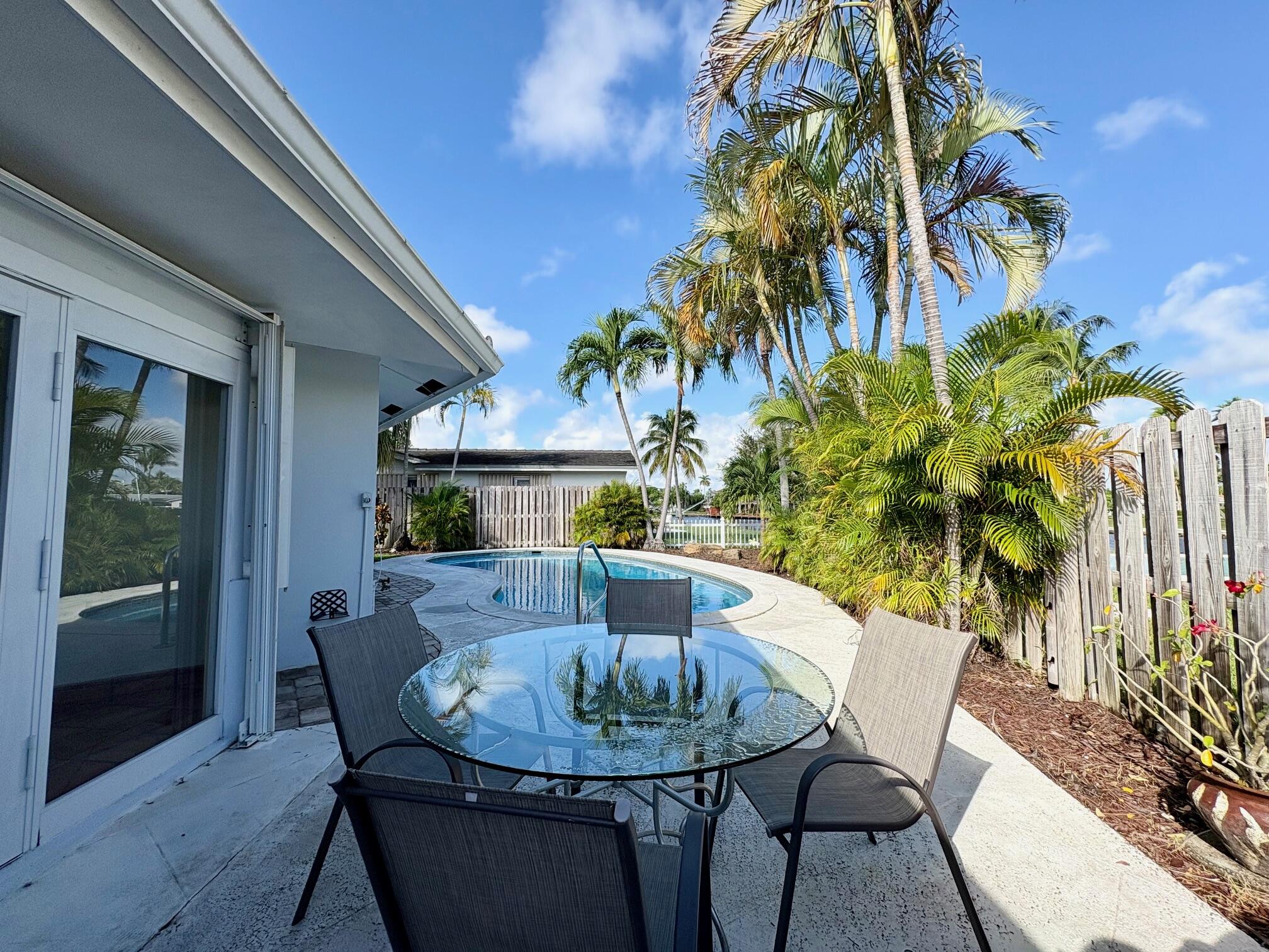 999 Southeast 6th Terrace Pompano Beach, FL 33060 - Photo 17 of 25 a view of a dining room with furniture and wooden floor