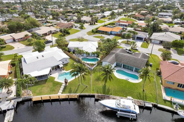 an aerial view of residential houses with outdoor space