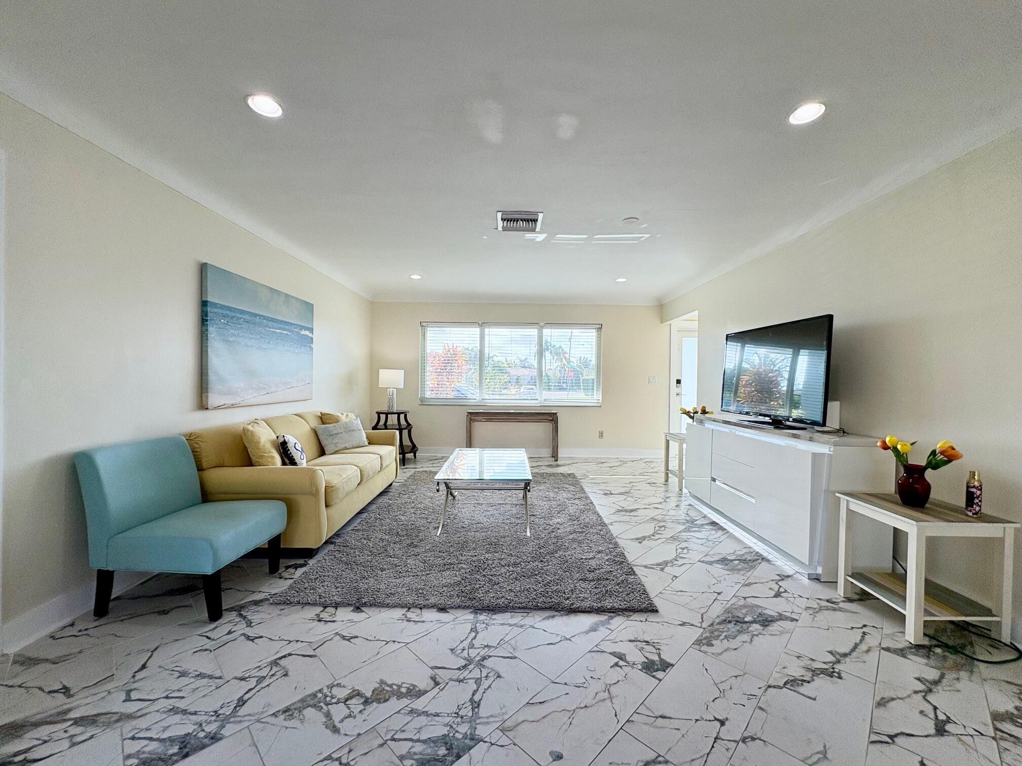 999 Southeast 6th Terrace Pompano Beach, FL 33060 - Photo 7 of 25 a living room with furniture and a window