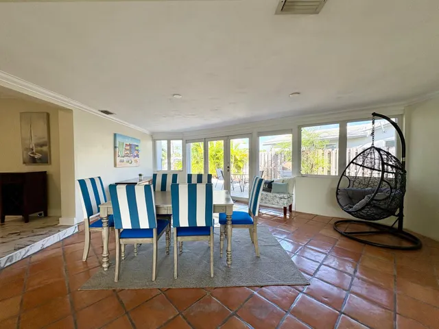 a view of dining room and hall with furniture