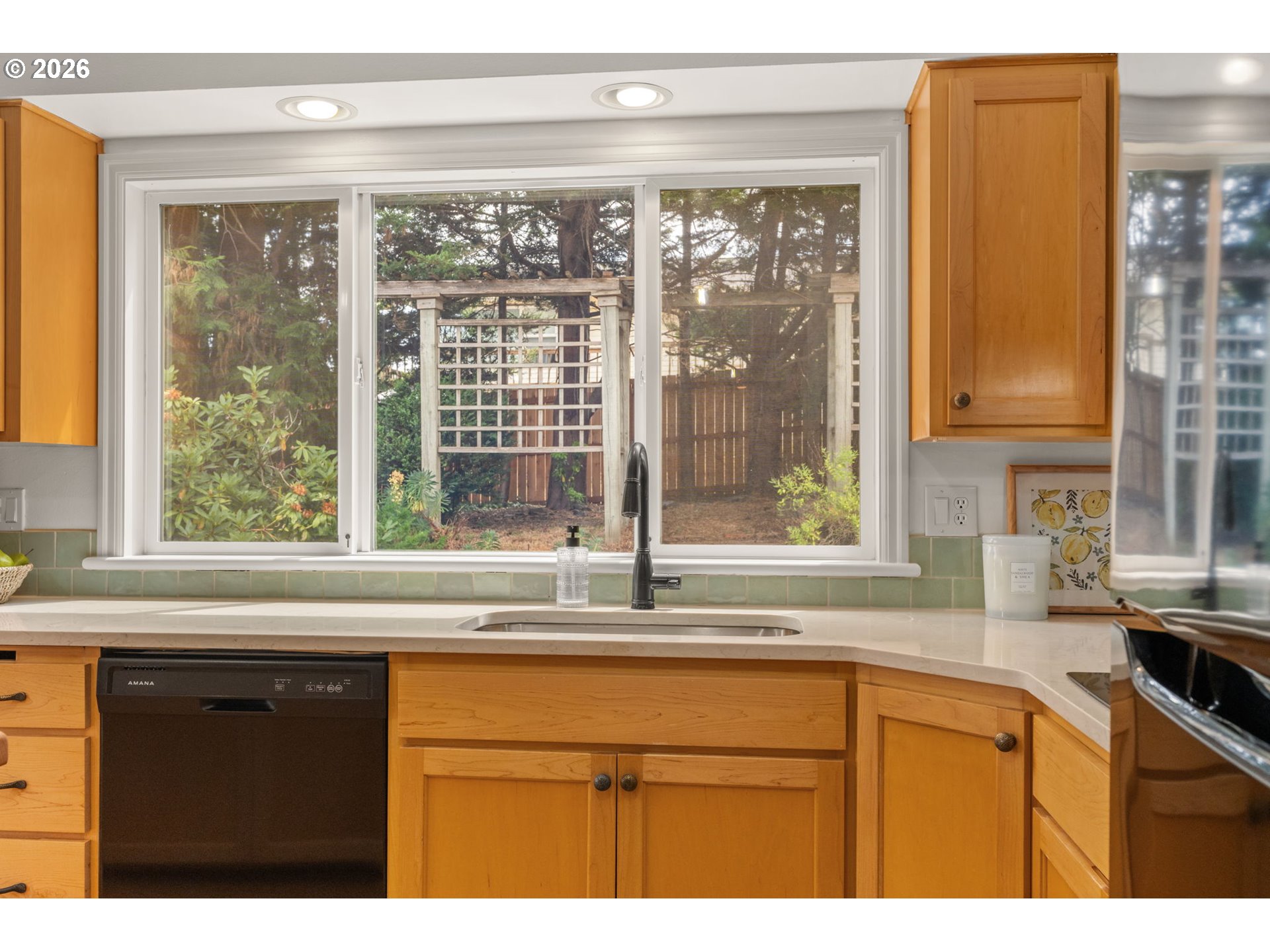1995 Greiner Street Eugene, OR 97405 - Photo 13 of 39 a kitchen with granite countertop a sink and a window