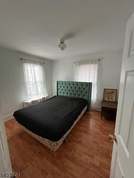 9 Madison Street Newton, NJ 07860 - Photo 5 of 13 a bed sitting in a bedroom next to a window
