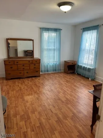 a room with a bed and a window