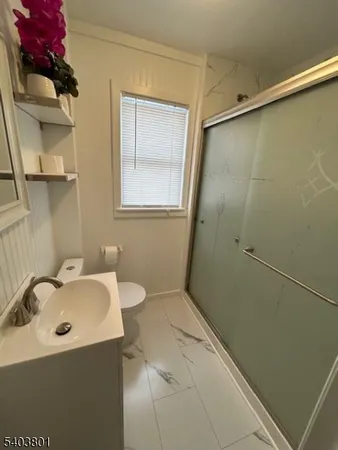 a bathroom with a sink and shower