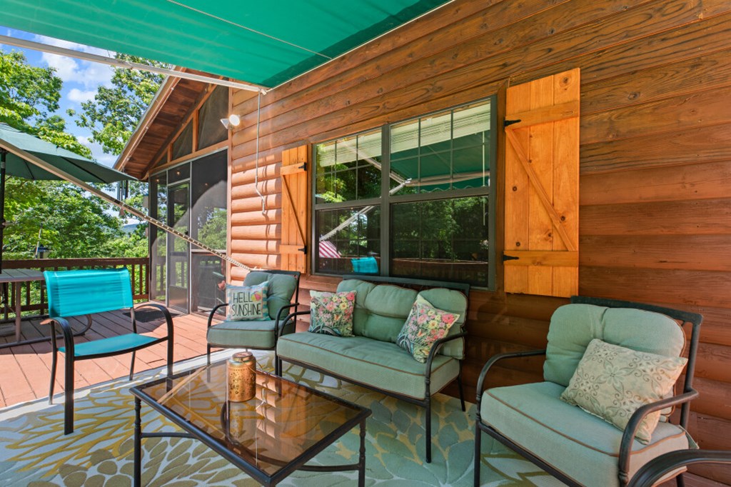 66 Fortenberry Road Young Harris, GA 30582 - Photo 43 of 55 a outdoor living space with patio furniture and a garden
