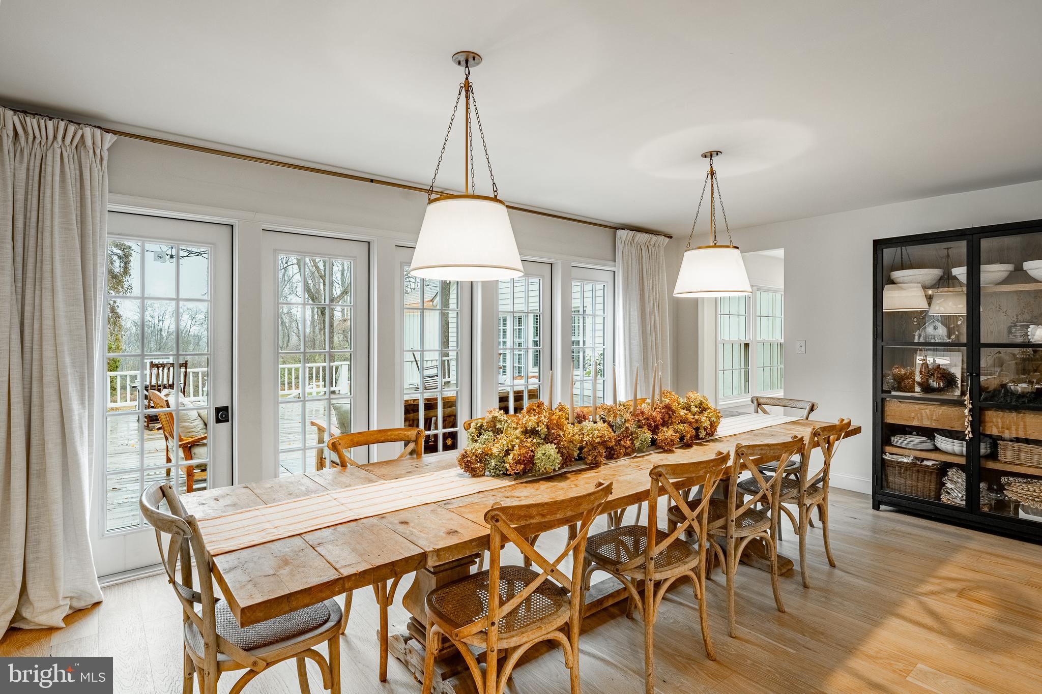 504 Kennett Pike Chadds Ford, PA 19317 - Photo 13 of 75 a dining room with furniture a chandelier and wooden floor