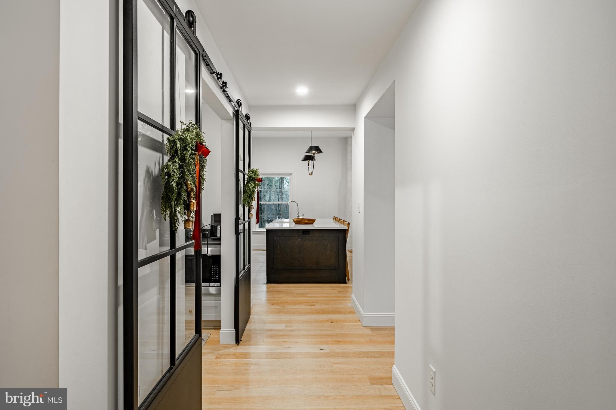 504 Kennett Pike Chadds Ford, PA 19317 - Photo 14 of 75 a view of a hallway view with wooden floor and staircase
