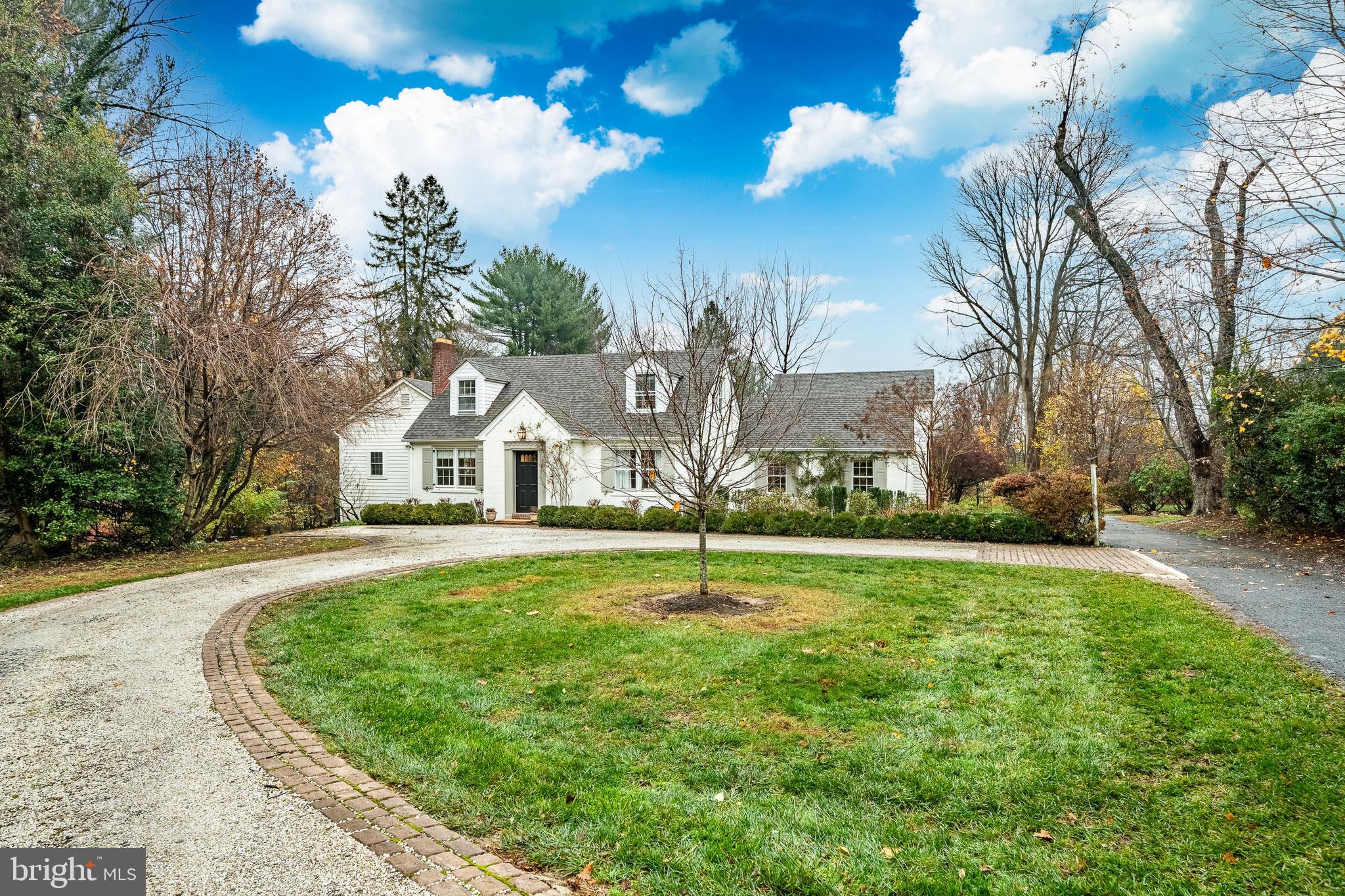 504 Kennett Pike Chadds Ford, PA 19317 - Photo 2 of 75 a front view of a house with a yard and garage