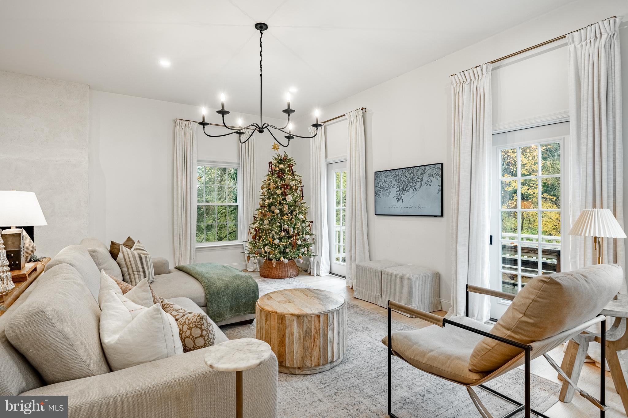 504 Kennett Pike Chadds Ford, PA 19317 - Photo 23 of 75 a living room with furniture and a chandelier