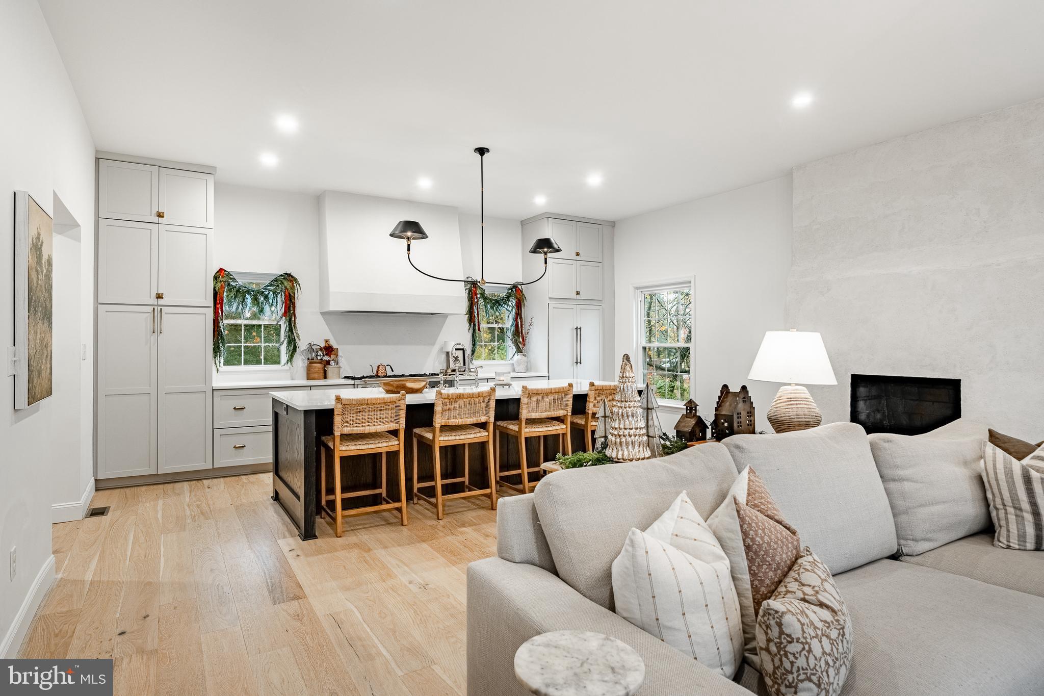 504 Kennett Pike Chadds Ford, PA 19317 - Photo 24 of 75 a living room with furniture kitchen view and a wooden floor