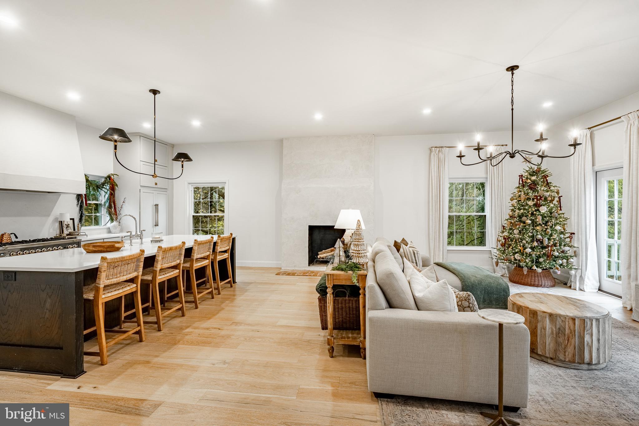 504 Kennett Pike Chadds Ford, PA 19317 - Photo 25 of 75 a living room with furniture a chandelier and a large window
