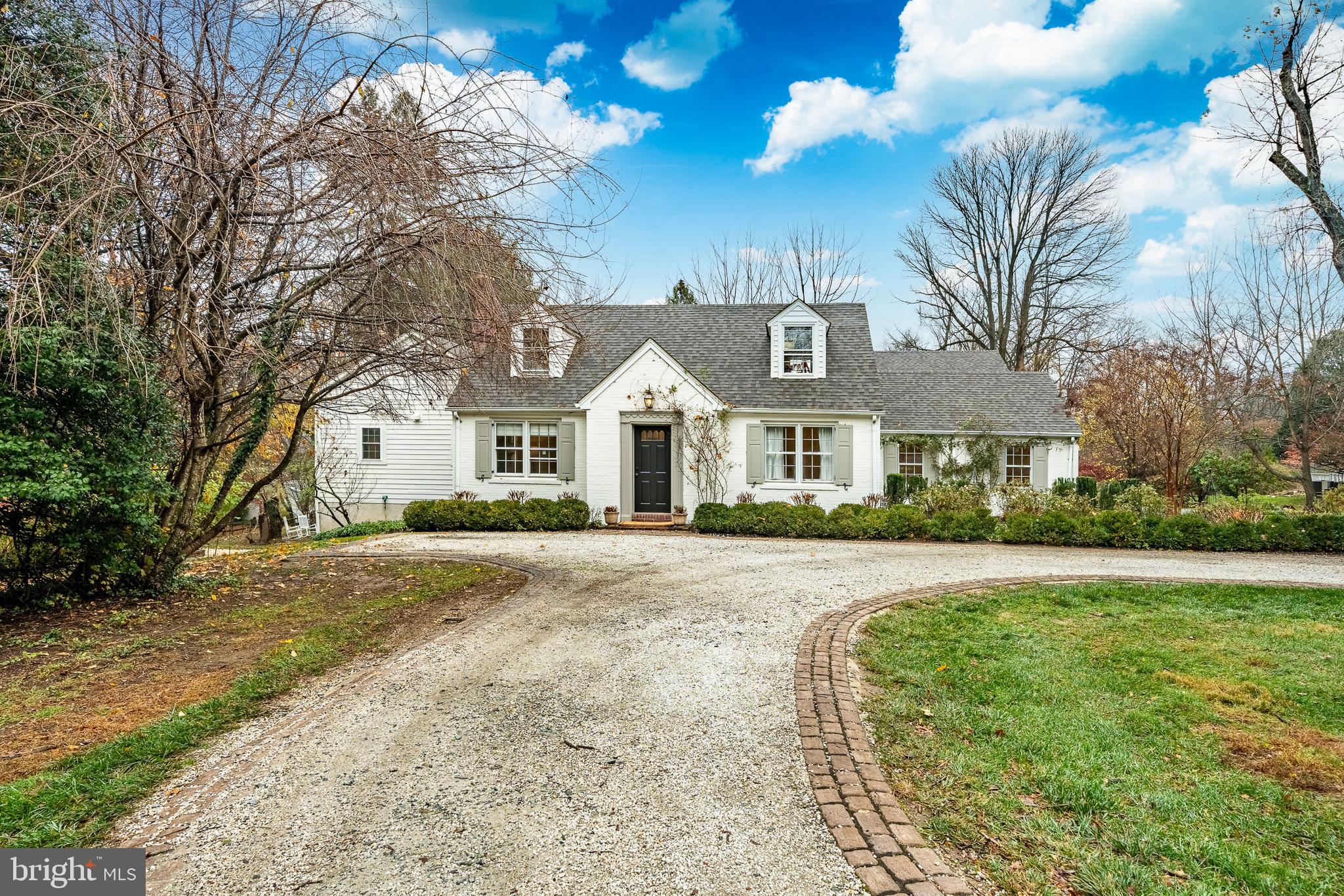 504 Kennett Pike Chadds Ford, PA 19317 - Photo 3 of 75 a front view of a house with a yard and trees