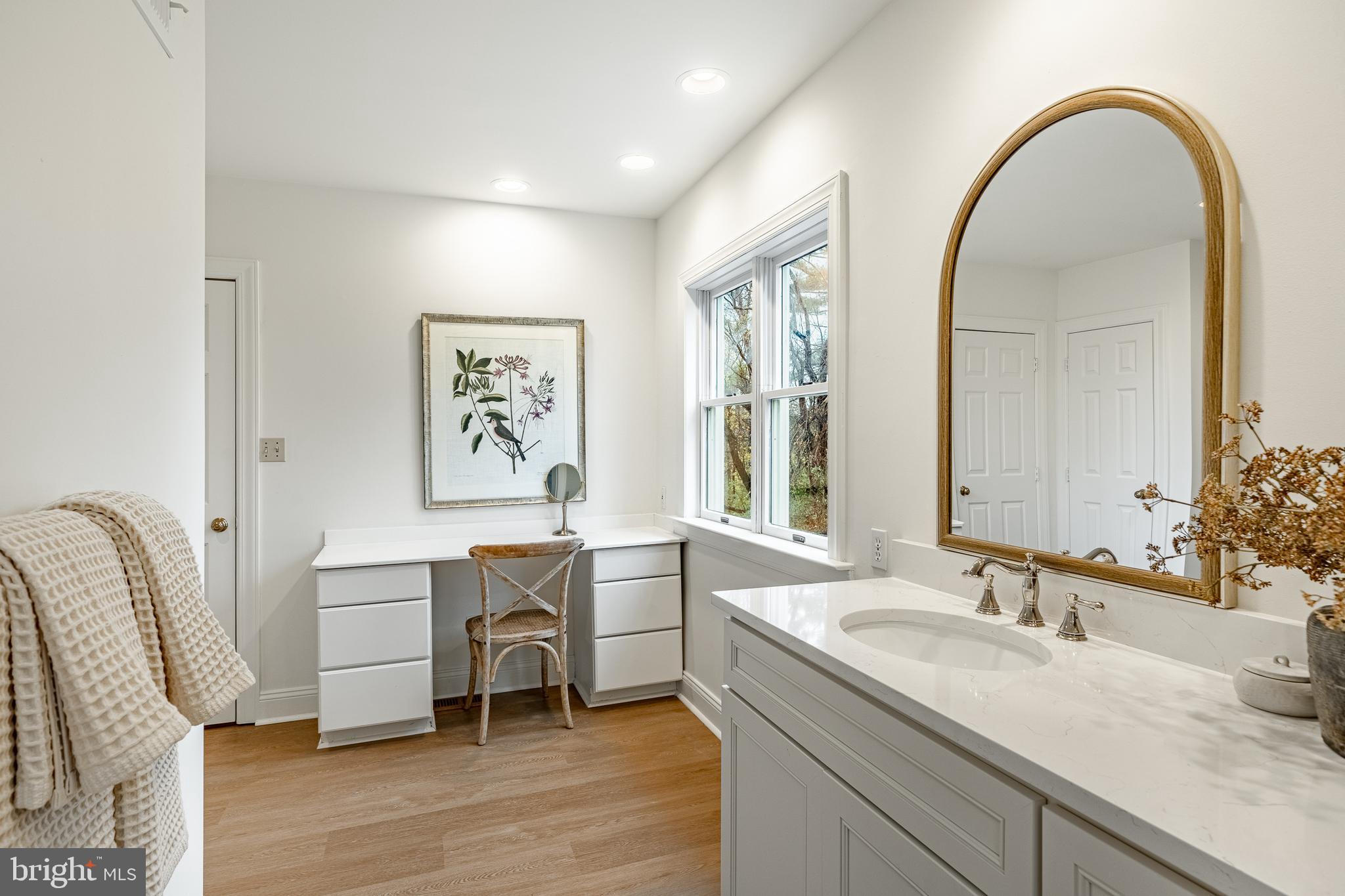 504 Kennett Pike Chadds Ford, PA 19317 - Photo 38 of 75 a spacious bathroom with a granite countertop sink a mirror and a