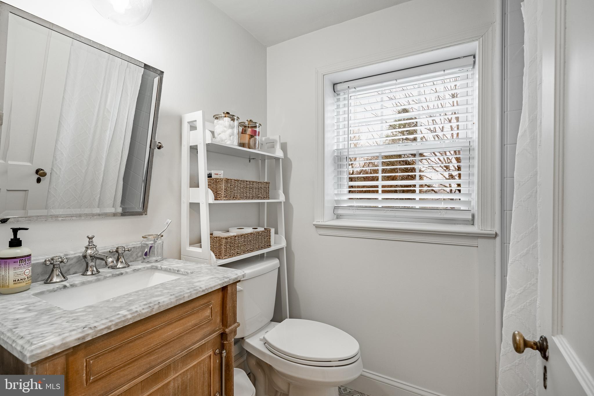 504 Kennett Pike Chadds Ford, PA 19317 - Photo 49 of 75 a bathroom with a granite countertop sink toilet and mirror