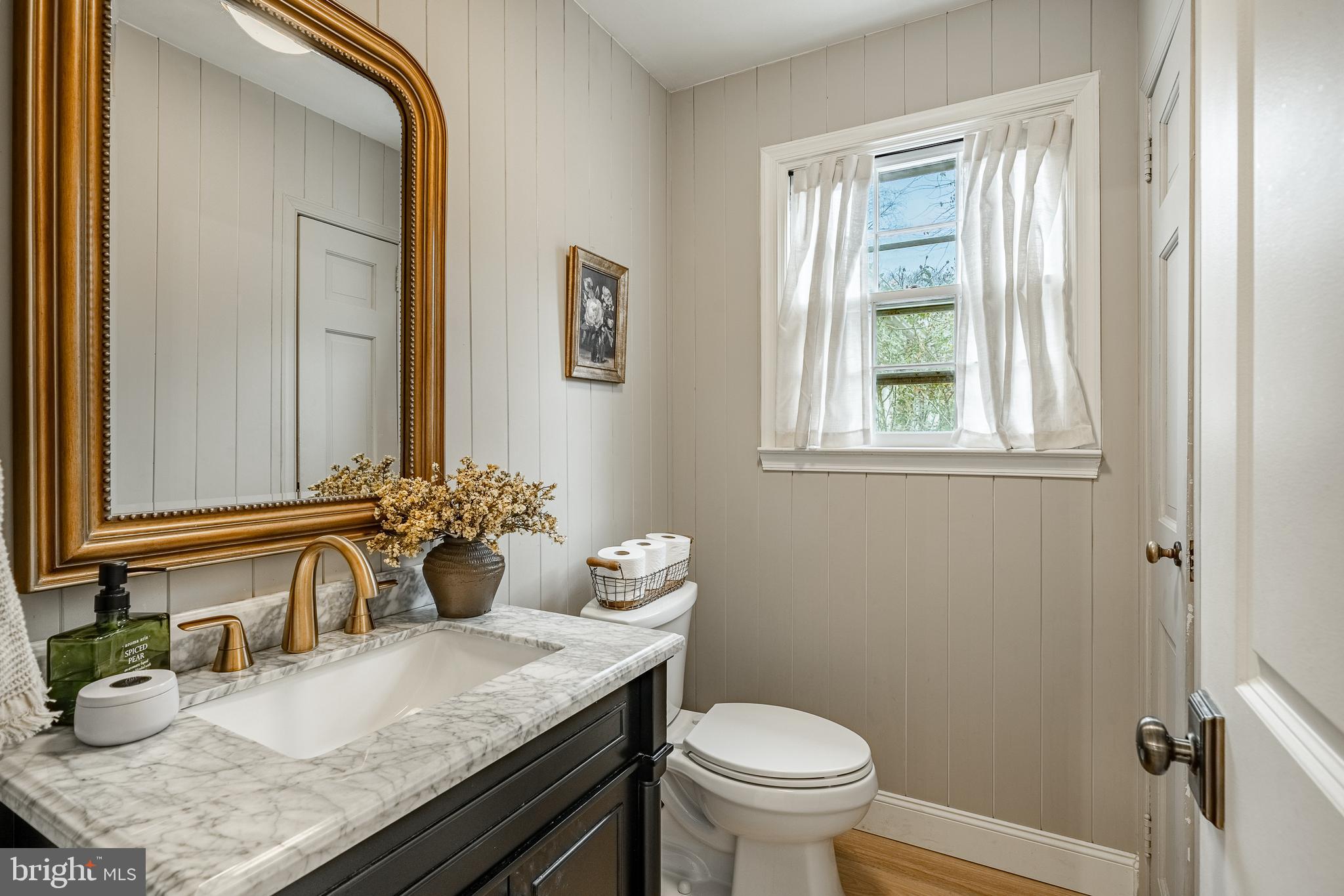 504 Kennett Pike Chadds Ford, PA 19317 - Photo 51 of 75 a bathroom with a granite countertop sink mirror vanity and toilet