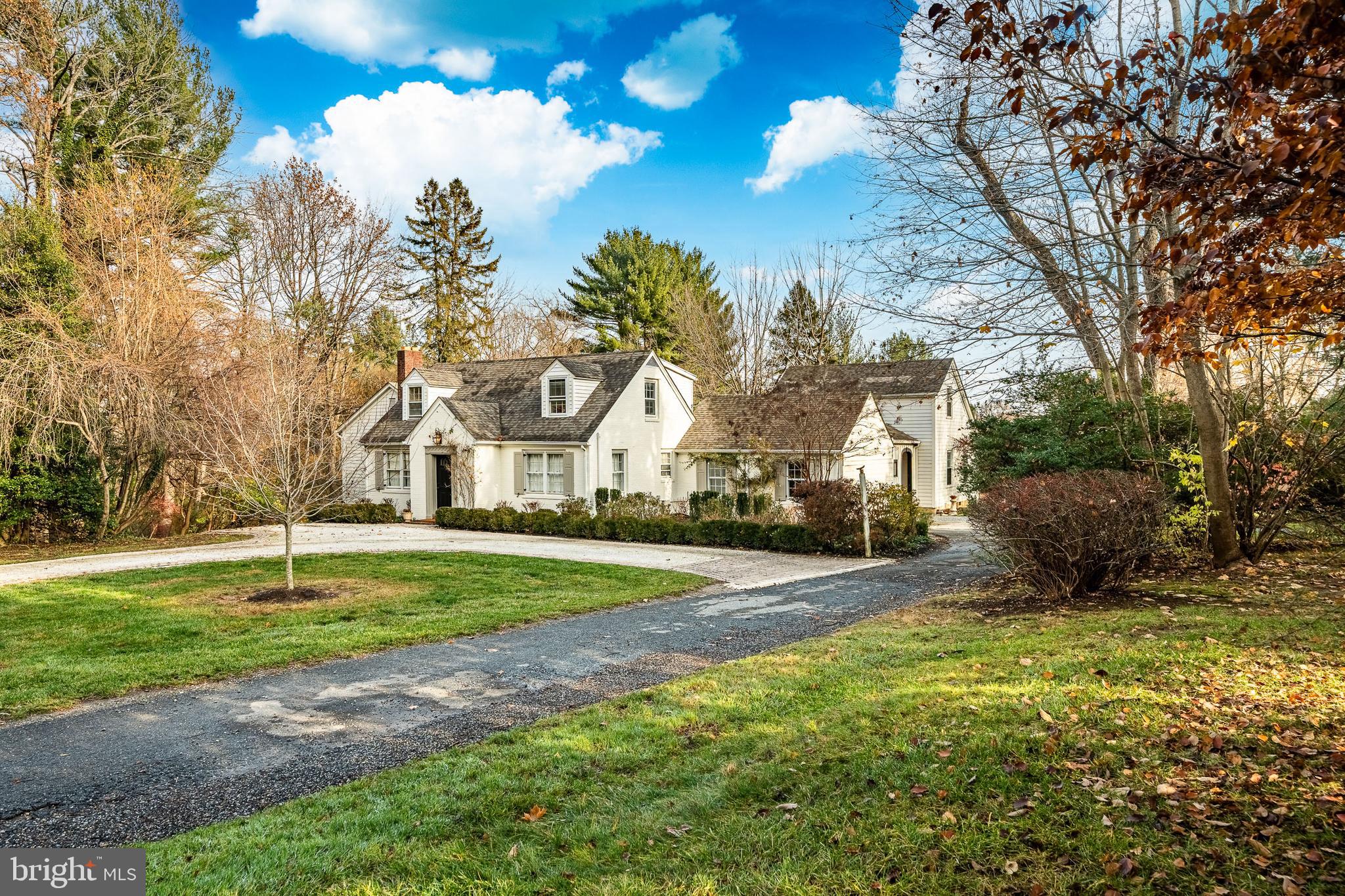 504 Kennett Pike Chadds Ford, PA 19317 - Photo 53 of 75 a view of a white house next to a yard with big trees