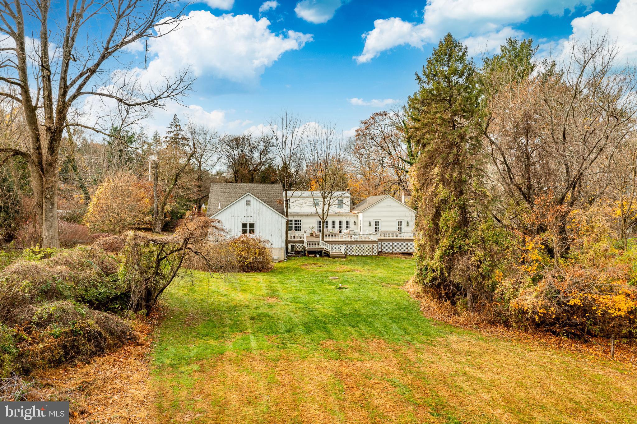 504 Kennett Pike Chadds Ford, PA 19317 - Photo 61 of 75 a view of a yard with a house in the background