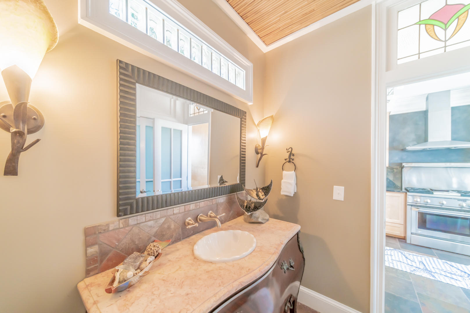 260 South Wall Street Inlet Beach, FL 32461 - Photo 21 of 59 a bathroom with a granite countertop sink and a mirror