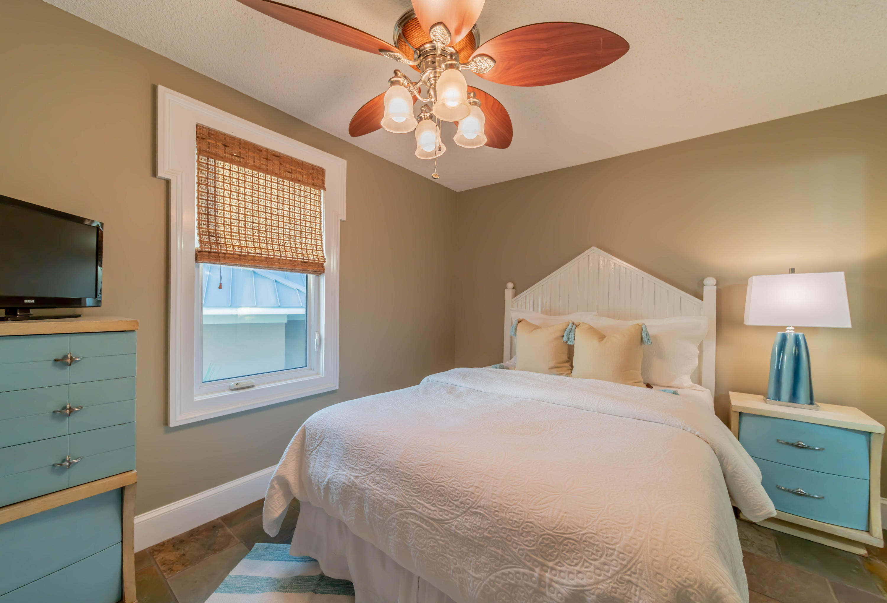260 South Wall Street Inlet Beach, FL 32461 - Photo 22 of 59 a bedroom with a bed and a flat tv screen on dresser