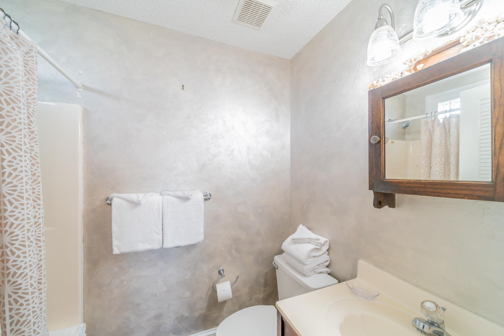 260 South Wall Street Inlet Beach, FL 32461 - Photo 23 of 59 a bathroom with a sink mirror and toilet