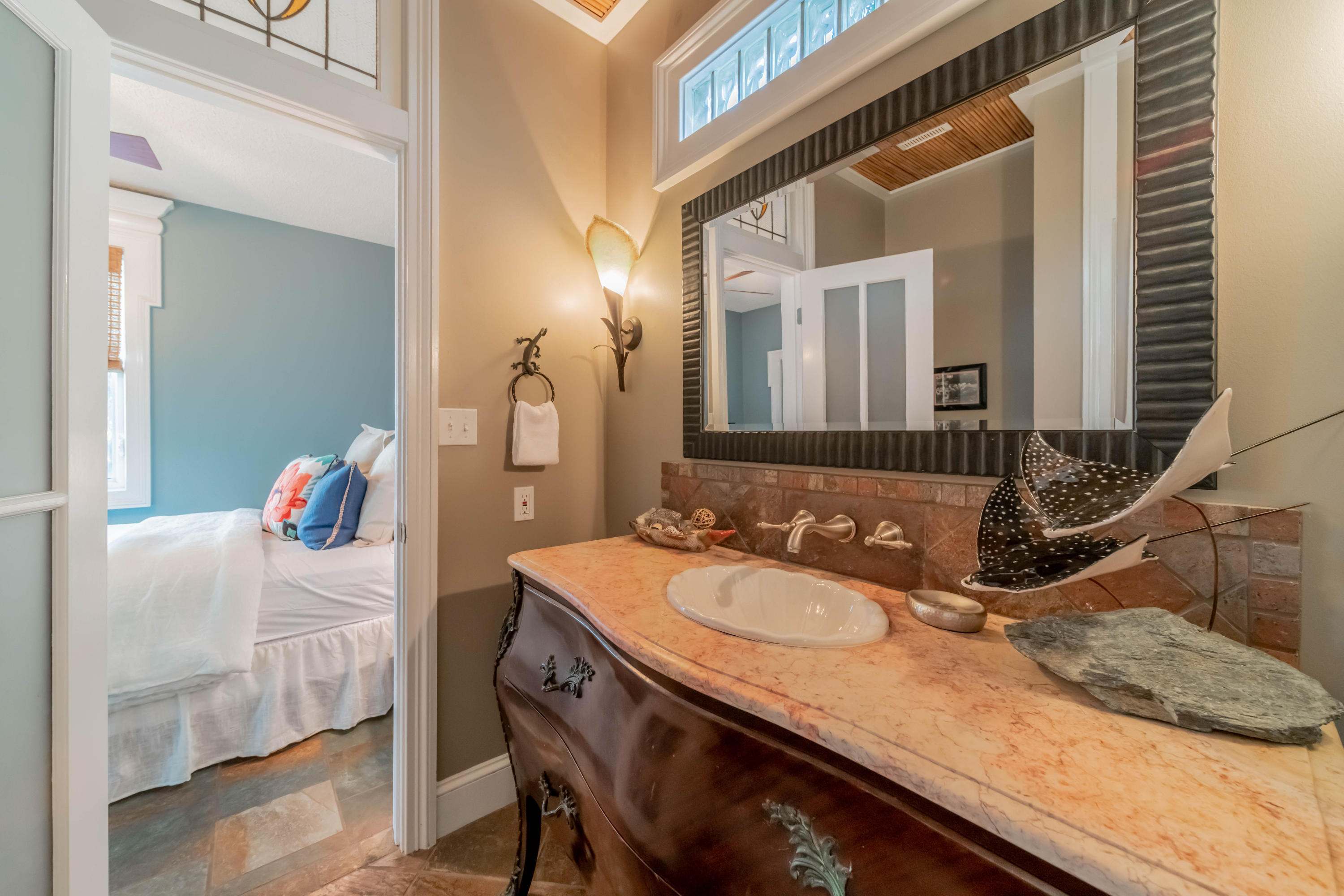 260 South Wall Street Inlet Beach, FL 32461 - Photo 27 of 59 a en suite bathroom with a granite countertop sink and a mirror