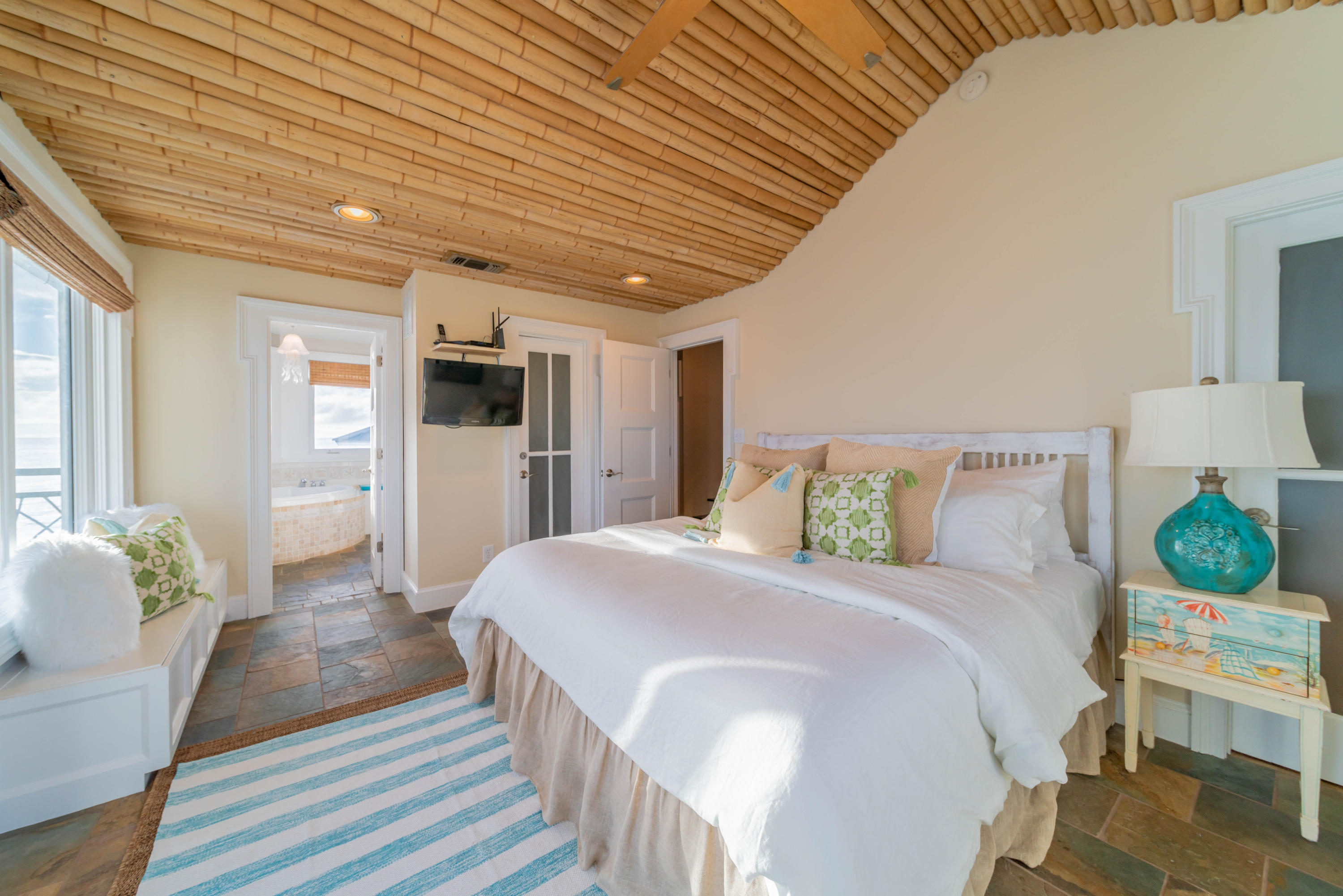 260 South Wall Street Inlet Beach, FL 32461 - Photo 43 of 59 a spacious bedroom with a bed and a table